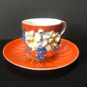 Vintage German peach lusterware teacup and saucer